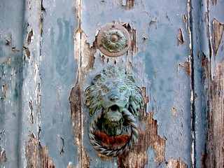 Weathered old door with knocker