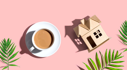 Wall Mural - Cardboard house with a cup of coffee - flat lay