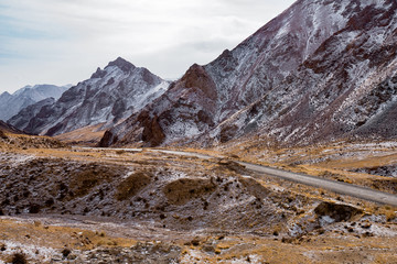 Wall Mural - the gravel road on the snow mountain