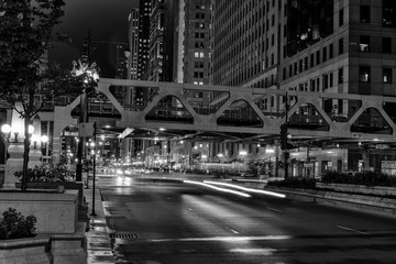 Poster - Chicago, night traffic between bridges and skyscrapers