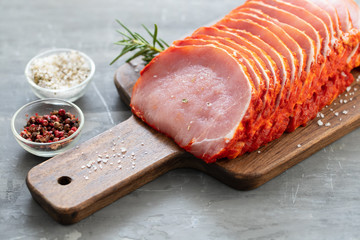 Sticker - marinated meat on wooden board with herbs