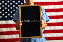 Health: Anonymous Doctor Holds Black Letterboard With #CORONAVIRUS