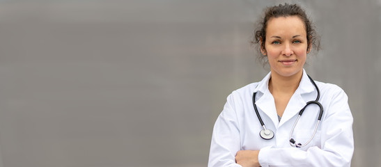 Biology and science. Young female doctor with stethoscope.