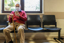 Elderly Man In A Hospital With Respirator