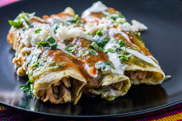 Wall Mural - Chicken Filled Green Enchiladas, Traditional Mexican Meal