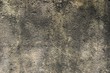 Dirty concrete wall texture soiled with coarse soot deposits on the surface horizontal background