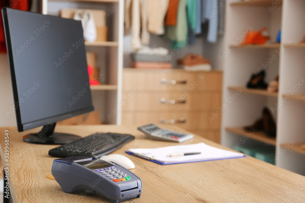 Modern workplace of seller in clothes store