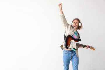 Sticker - Emotional man playing guitar on light background