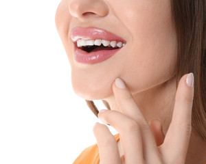 Wall Mural - Young woman with beautiful smile on white background, closeup