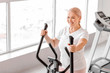 © Pixel-Shot - Sporty mature woman training in gym