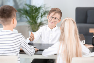 Sticker - Little real estate agent working with clients in office