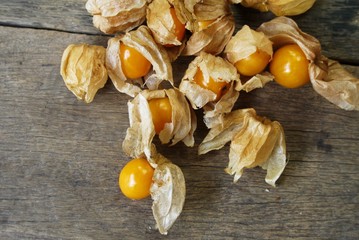 Cape Gooseberry on wooden floor texture with copy space  use for backgroud or wallpaper , selective  focus .