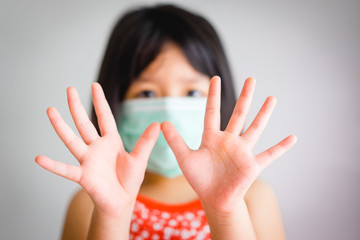 Wall Mural - Covid-19 coronavirus and epidemic virus symptoms concept.Child girl washing hands and showing clean hands in bathroom for stop coronavirus at home.Hand foot and mouth disease and coronavirus pandamic.