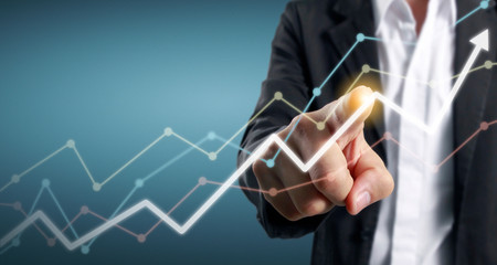 Hand touching  graphs of financial indicator and accounting market economy analysis chart