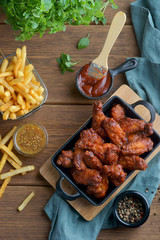 Wall Mural - fried wings with beer and French fries