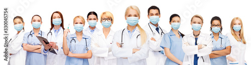 Fotografía health, medicine and pandemic concept - doctors and nurses wearing protective me