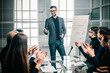 © yurolaitsalbert - business team applauds the speaker at the business presentation