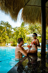 St Lucia Caribbean Island, young men and woman relaxing on the beach during vacation, luxury vacation Caribbean Saint Lucia