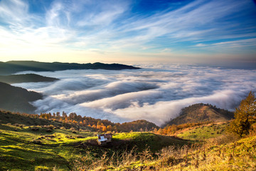 landscape of north of iran looking down to clouds from the peak in autumn