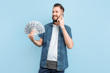 Wall Mural - Happy man with a fan of money in his hands