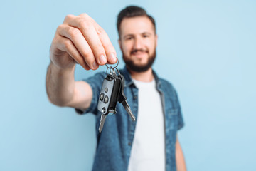 Wall Mural - young handsome man holding car keys