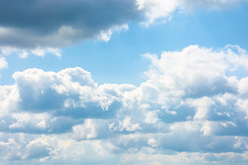 Wall Mural - gorgeous cloudscape in springtime. weather background with dynamic cloud arrangement on a blue sky. 