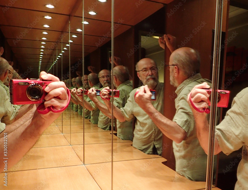 Multiple Reflection Of Senior Man Taking Selfie Through Camera In Restroom - obrazy, fototapety, plakaty 