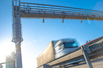 Wall Mural - truck passing through a toll gate on a highway toll roads