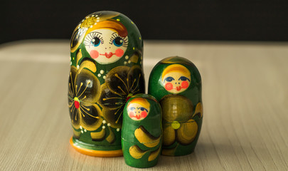 Wall Mural - three nesting dolls on the table