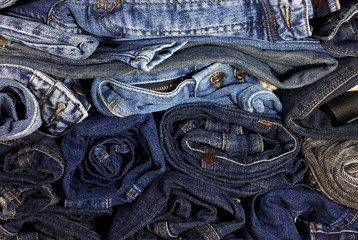 A pile of twisted jeans clothes as a background