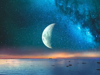 starry night moon on blue sky at sea, sunset at summer season , sea dark blue water reflection ,moon