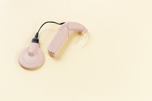 Cochlear Implant On The Arm. Hearing Aid