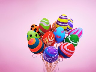 Wall Mural -  holding the colorful FAKE MOCKUP fancy Easter Eggs to celebrate the festival holiday