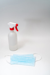 Wall Mural - Protective face mask and sanitizer gel dispenser on white background, against Novel coronavirus (2019-nCoV) or Wuhan coronavirus and Influenza. Antiseptic, Hygiene and Healthcare concept