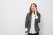 © Martin Villadsen - Happy beautiful Businesswoman is talking on the phone on a white background