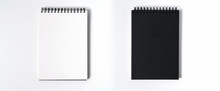 Notebook Mock Up With Clean Black Blank For Design And Advertising. Notepad With Chromed Spring And Free Copy Space Template. On The Gray Background.