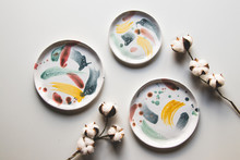 Hand-painted Ceramic Plates. Collection Of Colorful Ceramic On White Background