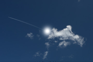 Wall Mural - airplane in the sky,clouds, plane, airplane, air, white, sun, fly, trail, heaven, light,travel, flying, space, jet, bright, beauty, aircraft