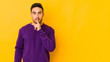 © Asier - Young caucasian man isolated on yellow bakground keeping a secret or asking for silence.