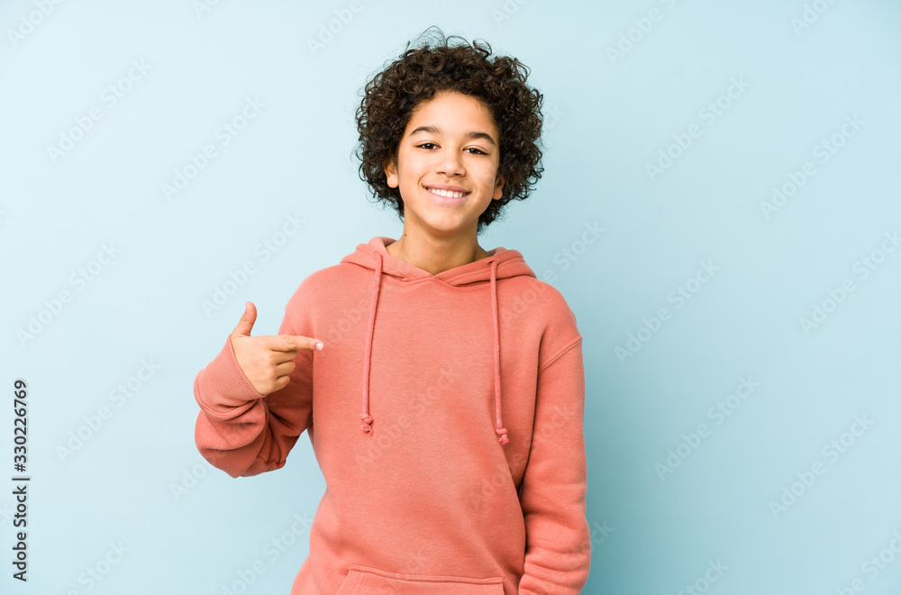 African american little boy isolated person pointing by hand to a shirt copy space, proud and confident - obrazy, fototapety, plakaty 