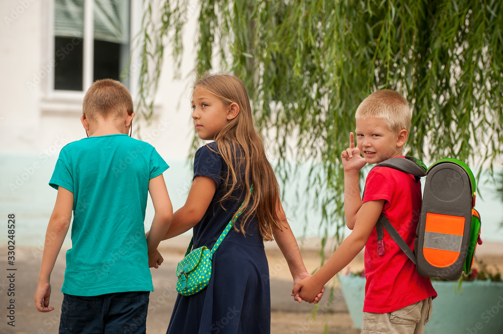 Children return to school. beginning of new school year after summer ...