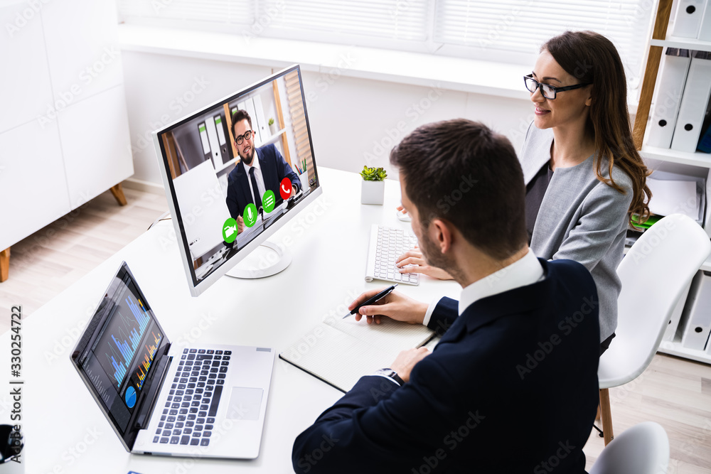 Computer Video Conferencing Two Businesspeople Video Conferencing On Computer Stock Photo | Adobe Stock
