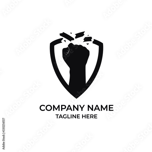 Foto The fist logo destroys the shield