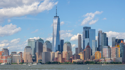 New York, NY, USA. Amazing skyline of Manhattan skyscrapers and buildings from Ellis Island. Landscape inclusive of the Freedom tower - One World Trade Center