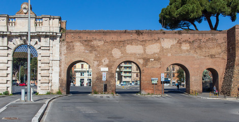 Wall Mural -  Rome, Italy - following the coronavirus outbreak, the italian Government has decided for a massive curfew, and now even the main Old Town landmarks, like Porta S.Giovanni, are totally empty