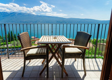 Terrace With Table And Chairs With View On Garda Lake In Gargnano Of Italy