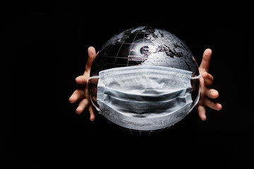Wall Mural - hands of little child holding globe sphere, planet map covered with medical protective mask isolated