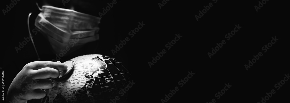 Kid hold globe put stethoscope on sphere, face covered in mask on black horizontal background. Ecological problems disasters. COVID-19 pandemic infection disease concept image, copy space for text - obrazy, fototapety, plakaty 