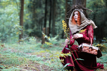 Wall Mural - The red-haired witch holds a ritual with a crystal ball