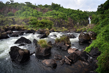 rushing waterfall and mountain river in the jungle